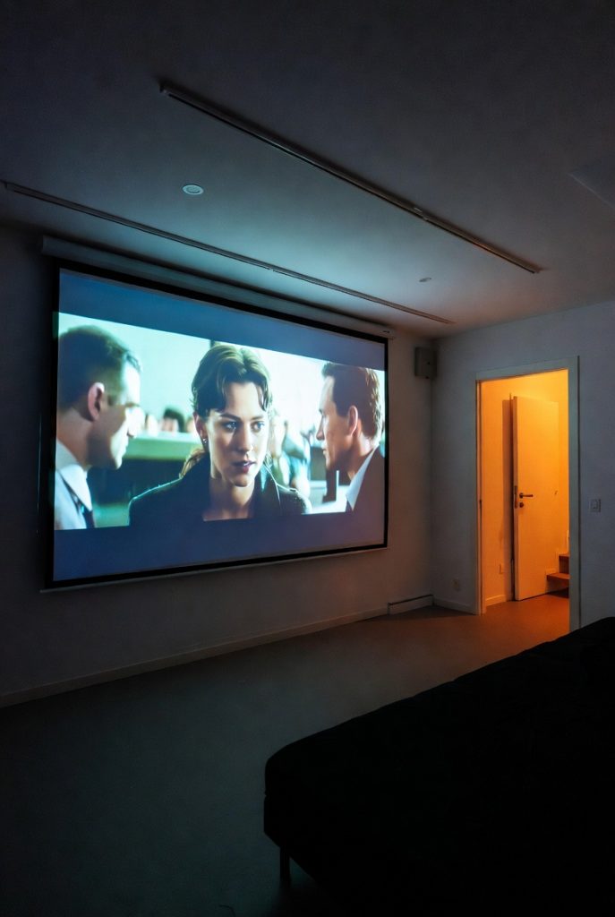 see a movie on a motorized projection screen